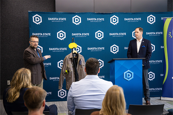 Dr. Justin Blessinger talking to the crowd during the press conference.